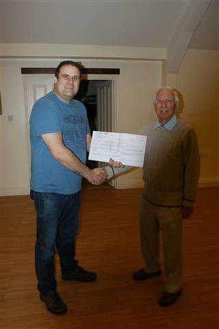 Paul presents a cheque for �150 raised for Sittingbourne MS to Smith Adams
